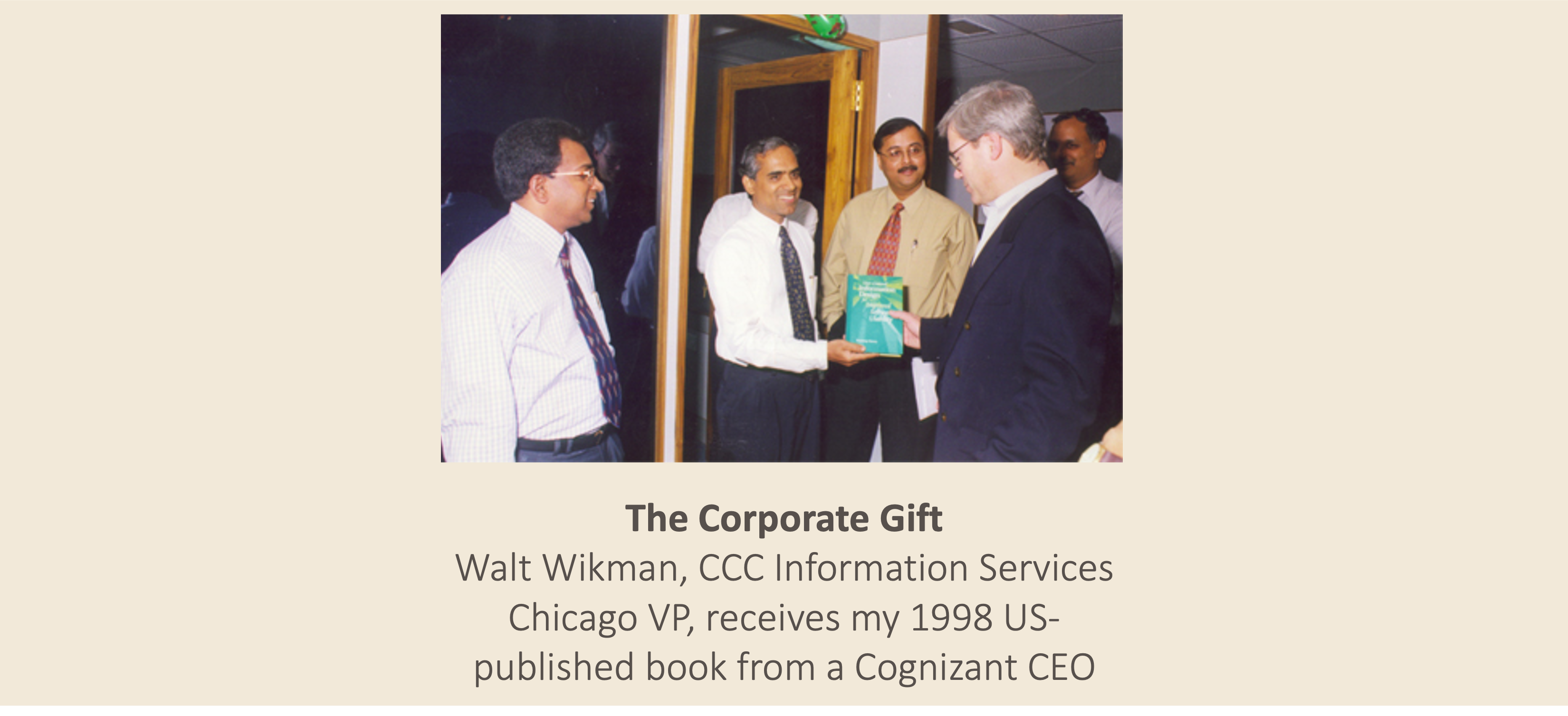 The Corporate Gift: Walt Wikman, CCC Information Services Chicago VP, receives my 1998 US-published book from a Cognizant CEO